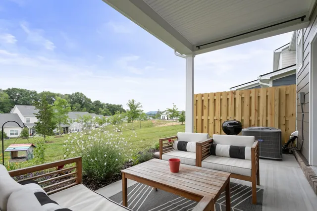 a view of a patio with couches chairs and a table and chairs