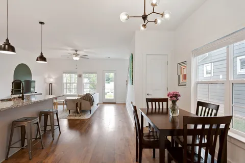 a view of a dining room with furniture window and outside view