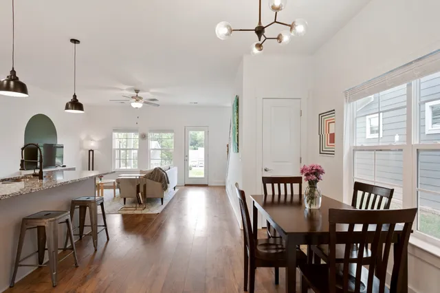 a view of a dining room with furniture window and outside view