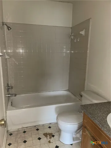 a bathroom with a sink and a toilet