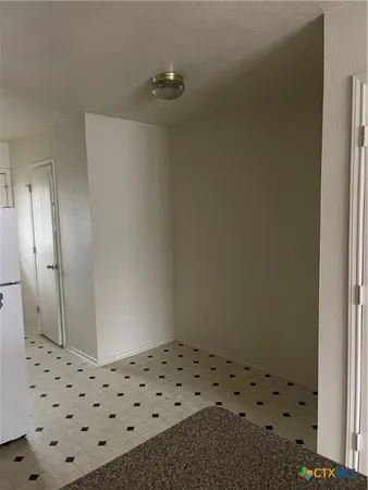 a bathroom with a shower and a sink