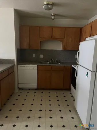 a kitchen with a cabinets and a stove