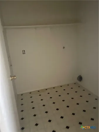 a white toilet sitting next to a window