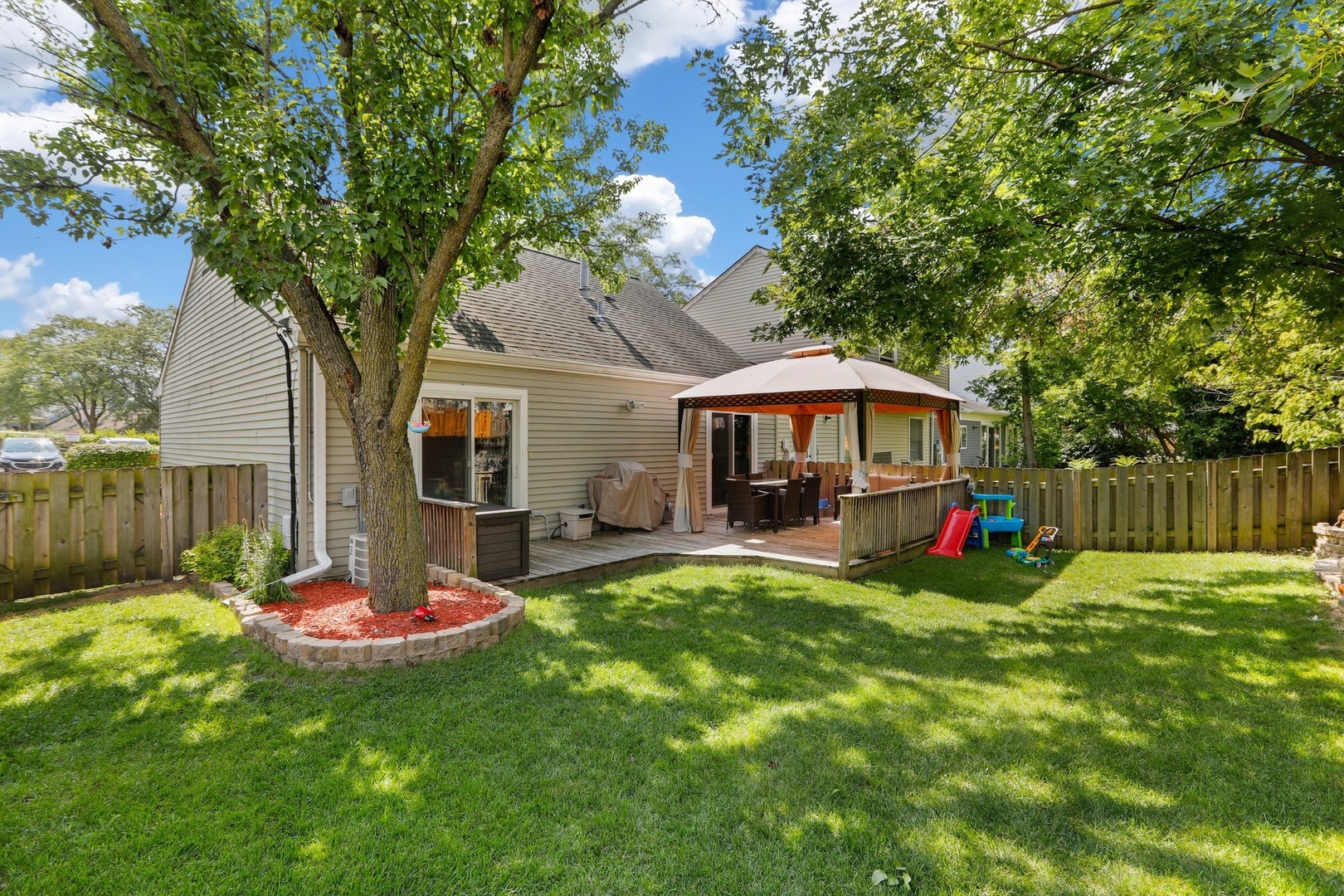 751 Taft Circle Hanover Park, IL 60133 - Photo 11 of 14 a view of a house with backyard