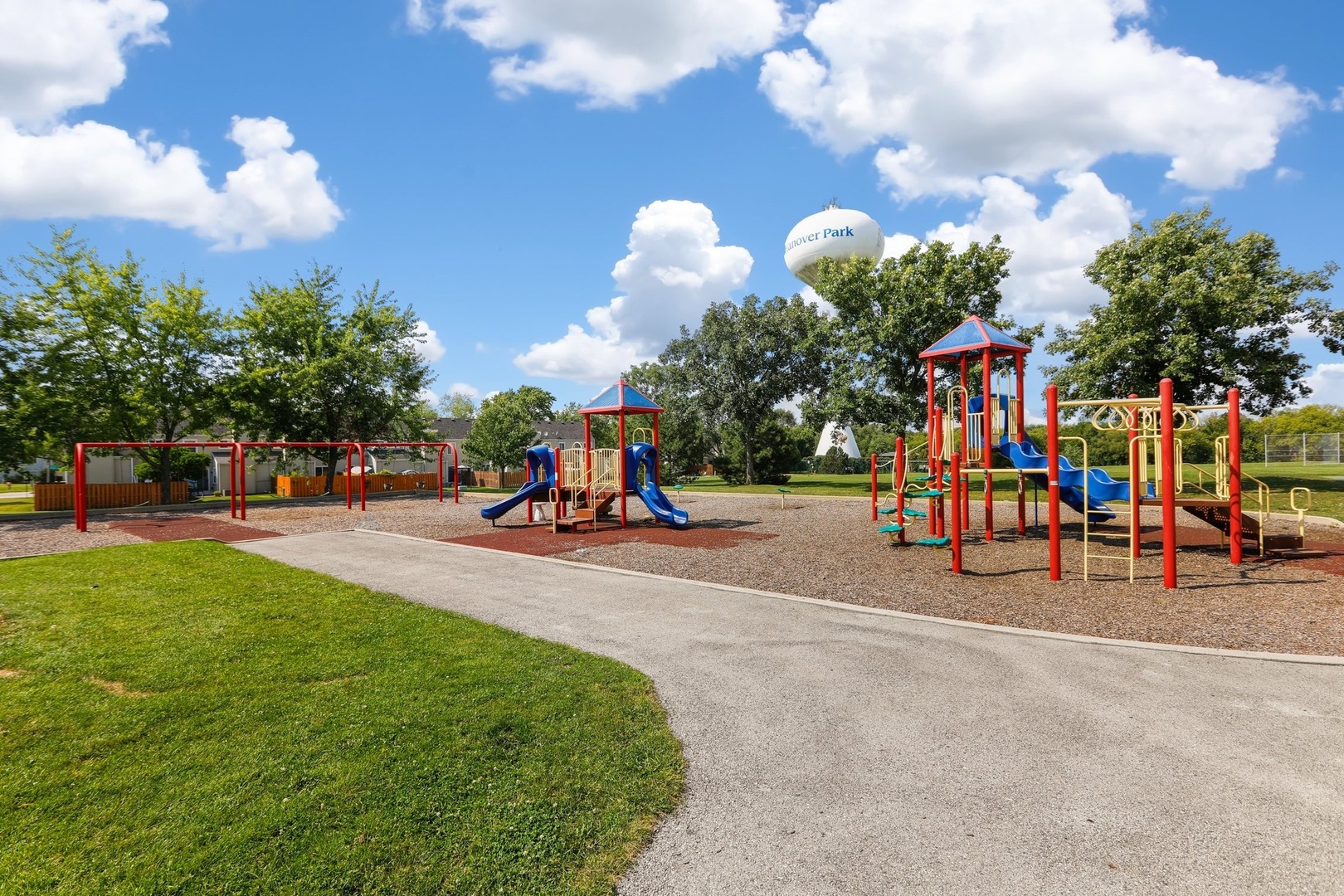 751 Taft Circle Hanover Park, IL 60133 - Photo 13 of 14 a view of a park with swings and slides