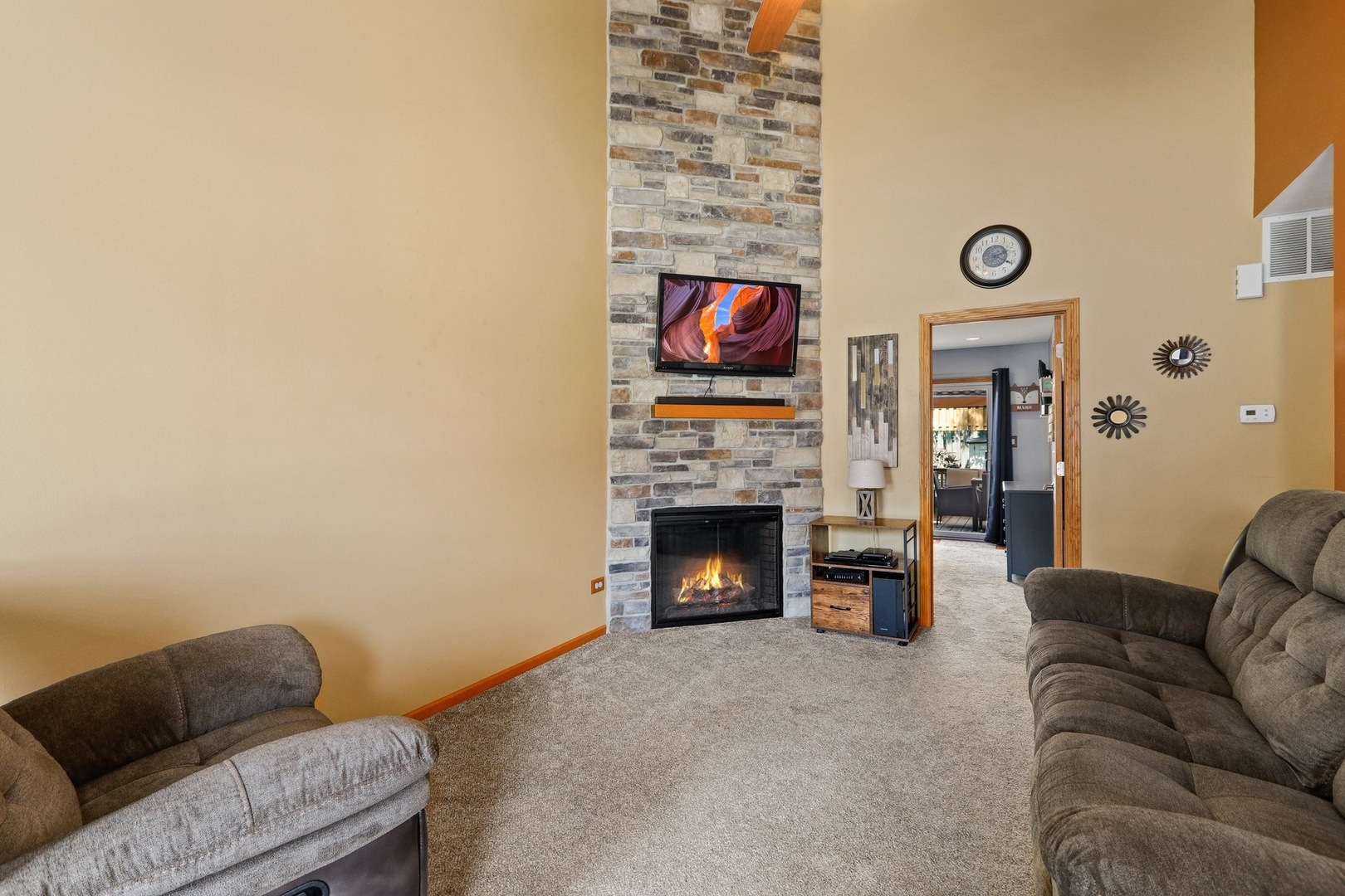 751 Taft Circle Hanover Park, IL 60133 - Photo 2 of 14 a living room with furniture and a fireplace