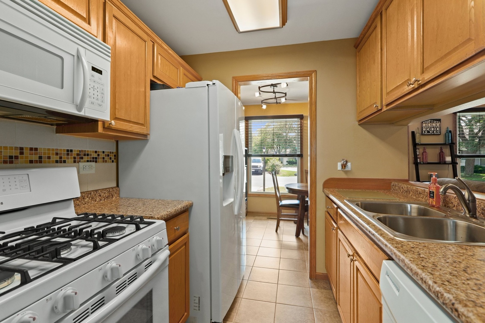 751 Taft Circle Hanover Park, IL 60133 - Photo 6 of 14 a kitchen that has a sink and a stove