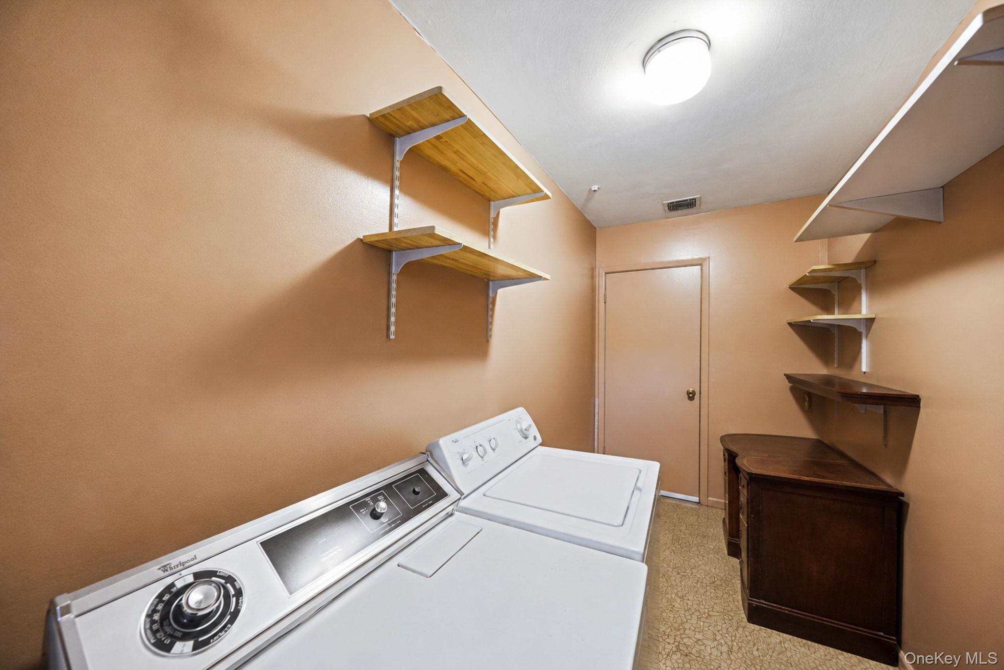 96 Fulton Boulevard Commack, NY 11725 - Photo 18 of 41 a utility room with dryer and washer