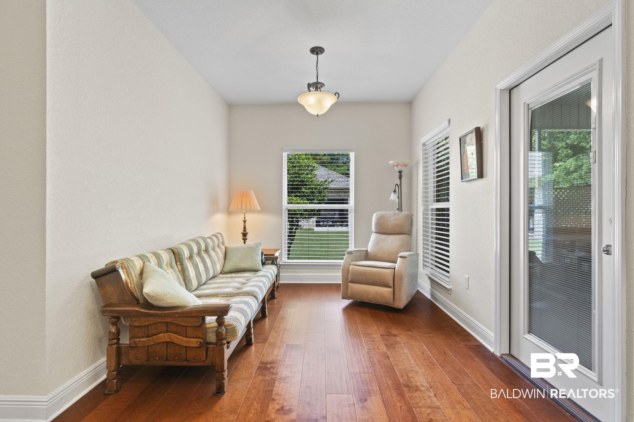 8664 Foxtail Loop Pensacola, FL 32526 - Photo 35 of 64 Living area with hardwood / wood-style floors and baseboards