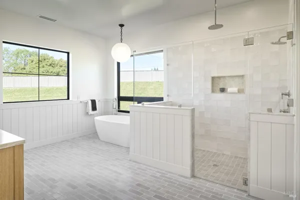a white bath tub sitting next to a window
