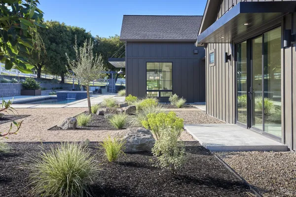 a view of a patio with couches and pool