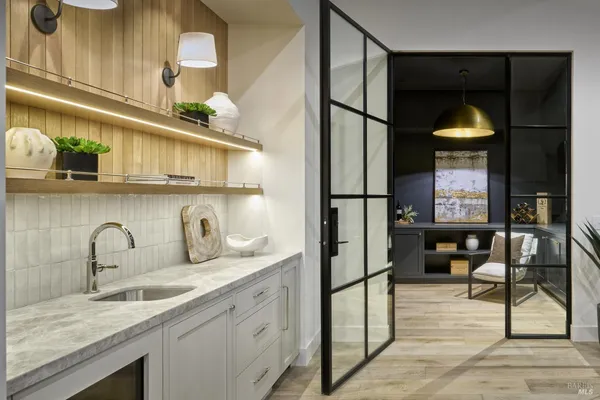 a kitchen with stainless steel appliances granite countertop a sink and cabinets