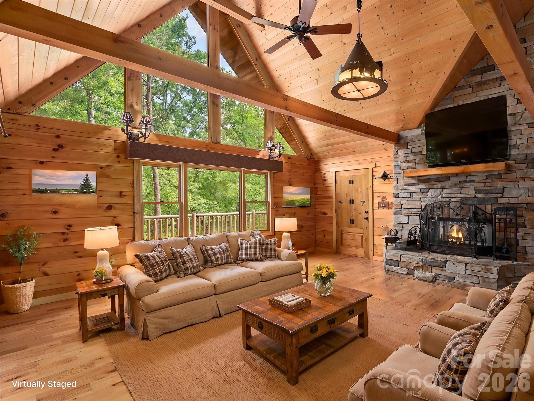 413 Green Hills Road Mill Spring, NC 28756 - Photo 6 of 48 a living room with fireplace furniture and a flat screen tv