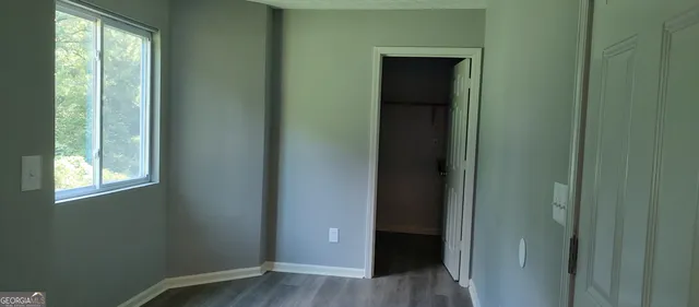 a view of front door with wooden floor