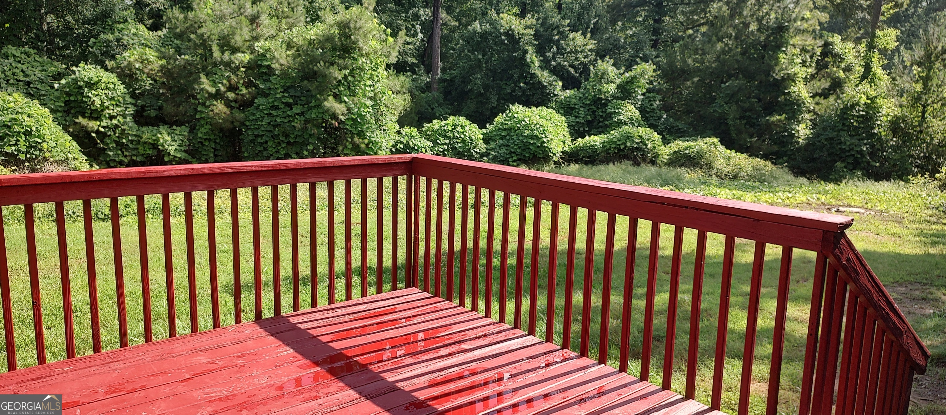 356 Mays Road Stockbridge, GA 30281 - Photo 5 of 9 a view of a wooden roof deck