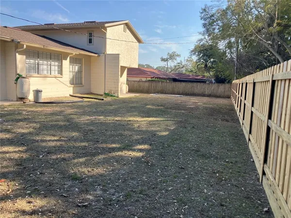 a view of a back yard of the house