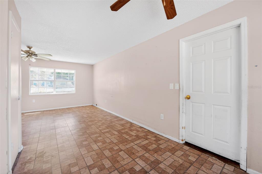 540 Pine Court Altamonte Springs, FL 32714 - Photo 12 of 30 an empty room with windows and fan