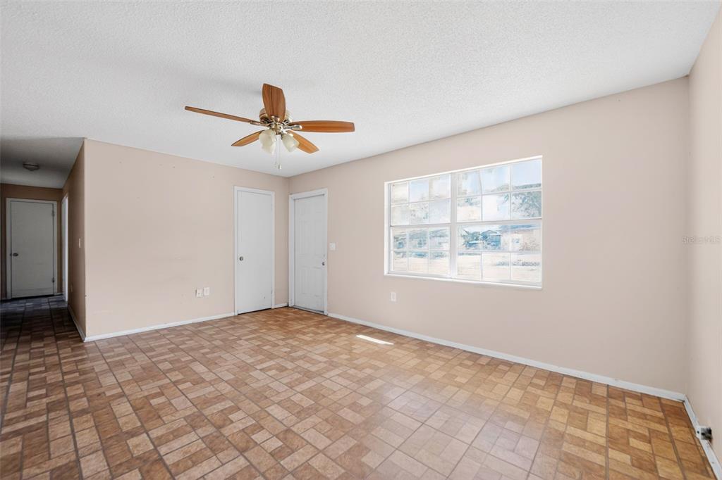 540 Pine Court Altamonte Springs, FL 32714 - Photo 14 of 30 a view of a room with a window and a ceiling fan