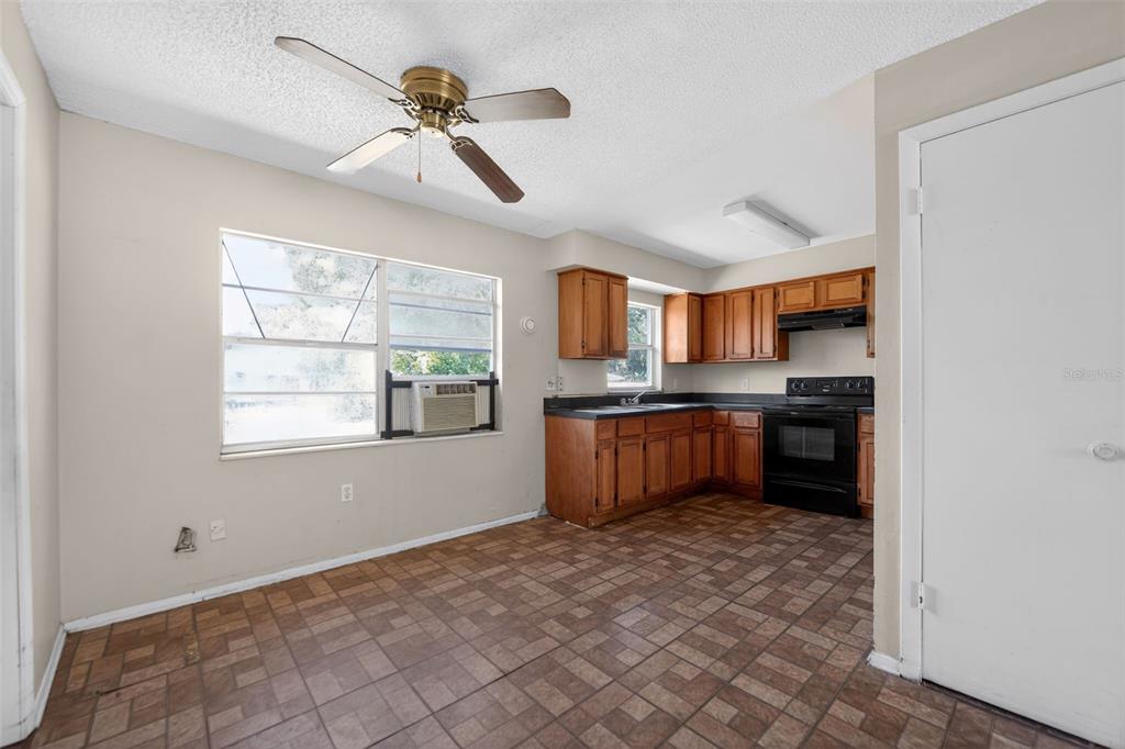 540 Pine Court Altamonte Springs, FL 32714 - Photo 21 of 30 a view of kitchen with granite countertop cabinets and window