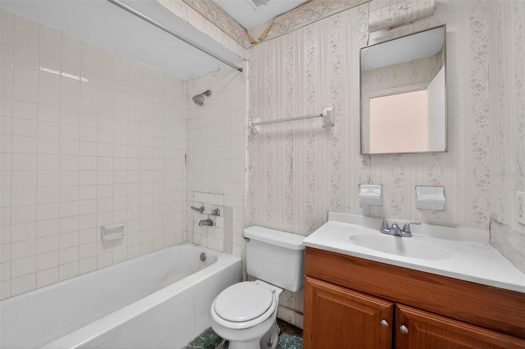 540 Pine Court Altamonte Springs, FL 32714 - Photo 27 of 30 a bathroom with a sink a toilet and shower