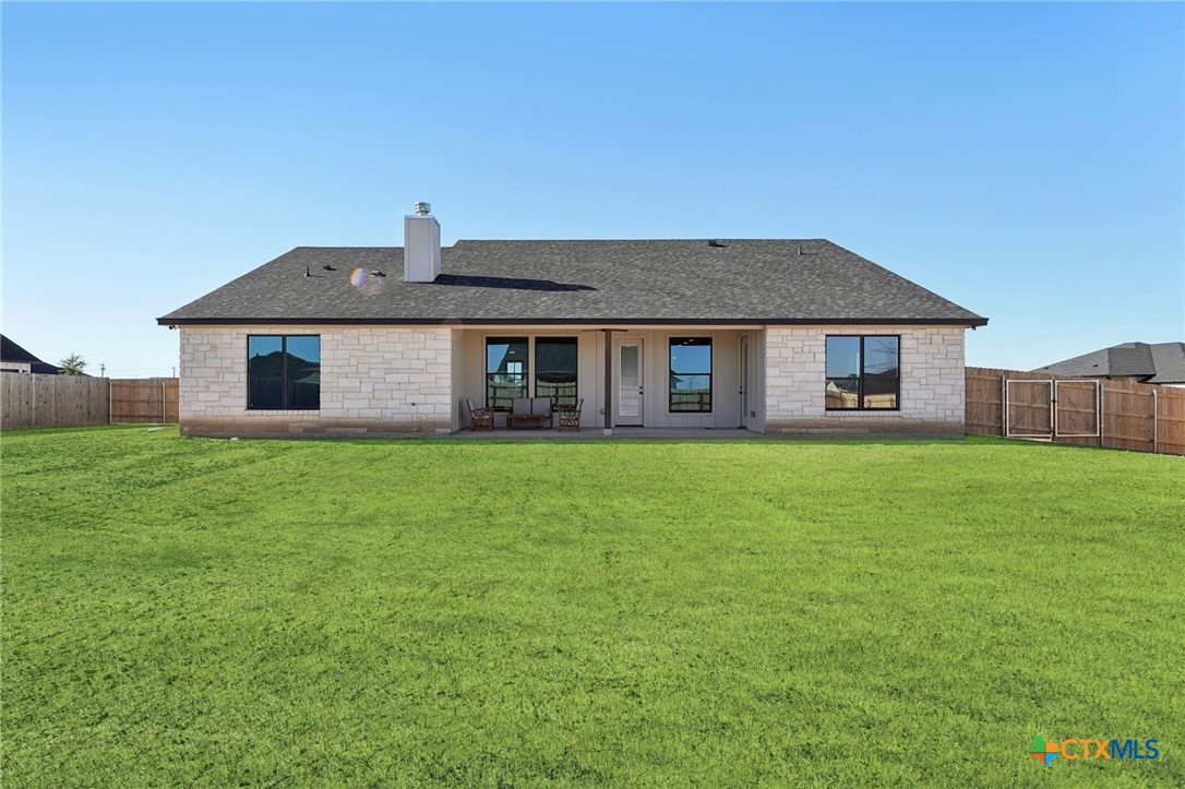 5207 Hollow Ranch Drive Salado, TX 76571 - Photo 36 of 37 a front view of a house with a garden