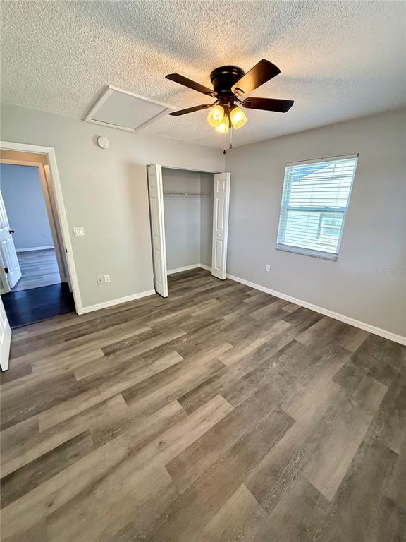 8124 Cormel Street, Unit 8126 Port Richey, FL 34668 - Photo 12 of 13 a view of an empty room with a window