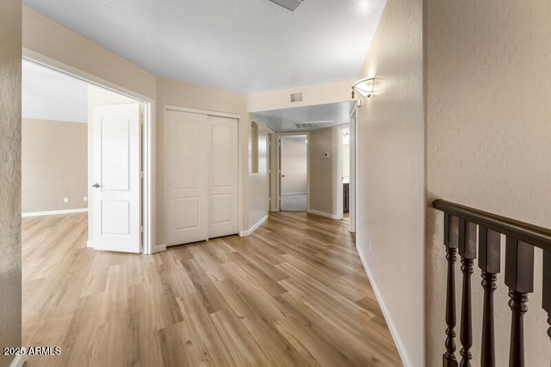 1691 West Commerce Avenue Gilbert, AZ 85233 - Photo 17 of 34 a view of a hallway with wooden floor