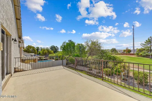 a spacious bathroom with a double vanity sink mirror and shower