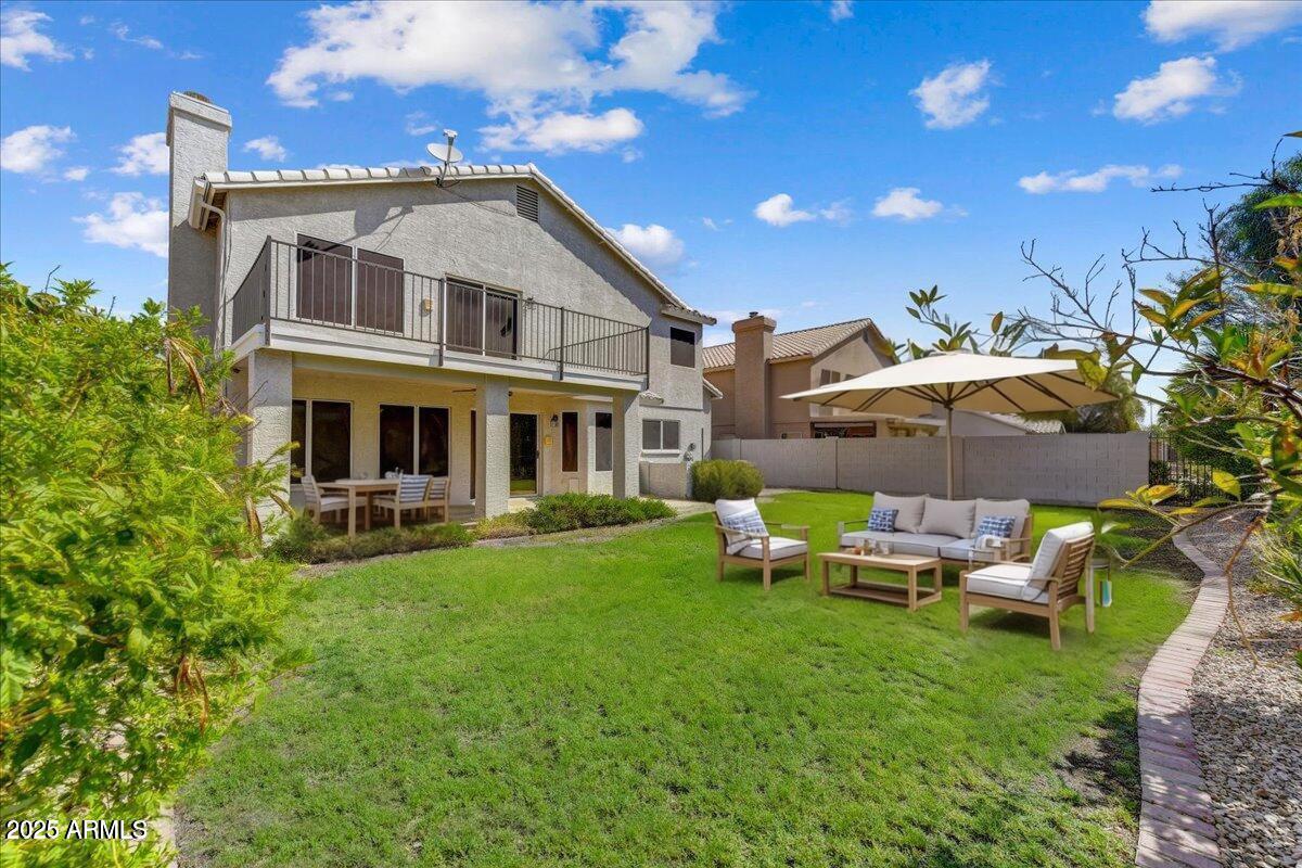 1691 West Commerce Avenue Gilbert, AZ 85233 - Photo 32 of 34 a front view of house with a garden