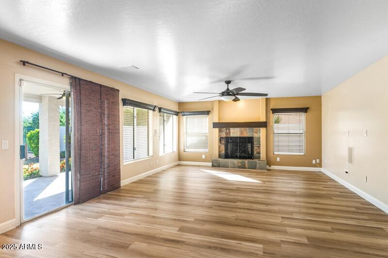 1691 West Commerce Avenue Gilbert, AZ 85233 - Photo 8 of 34 a view of an empty room with window and fire place