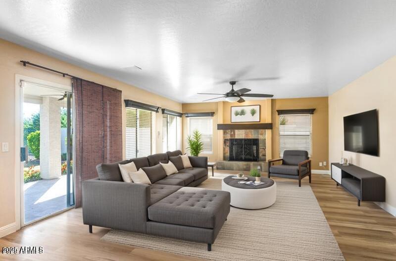 1691 West Commerce Avenue Gilbert, AZ 85233 - Photo 9 of 34 a living room with furniture fireplace and flat screen tv