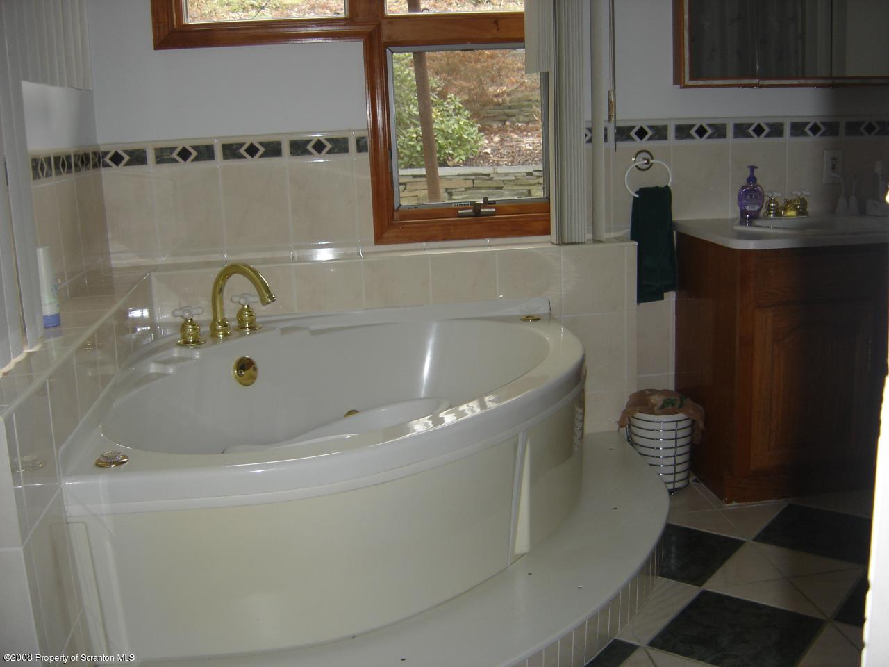 563 Point Rd Lake Factoryville, PA 18419 - Photo 13 of 14 a bathroom with a bathtub