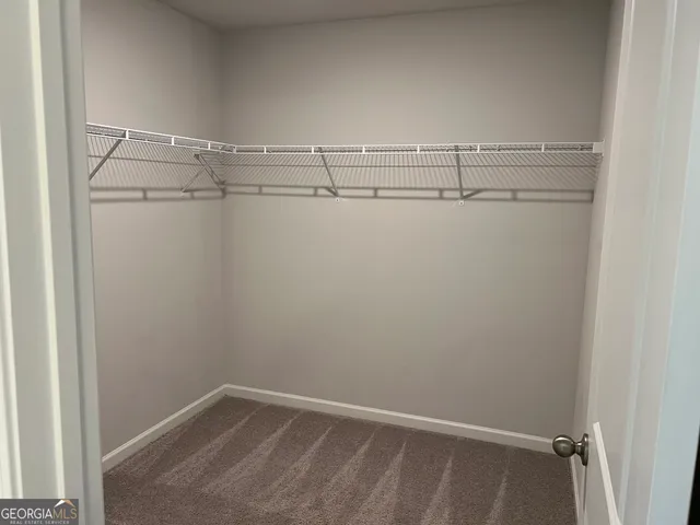 a view of an empty walk in closet