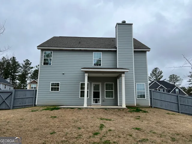 a front view of a house with garage