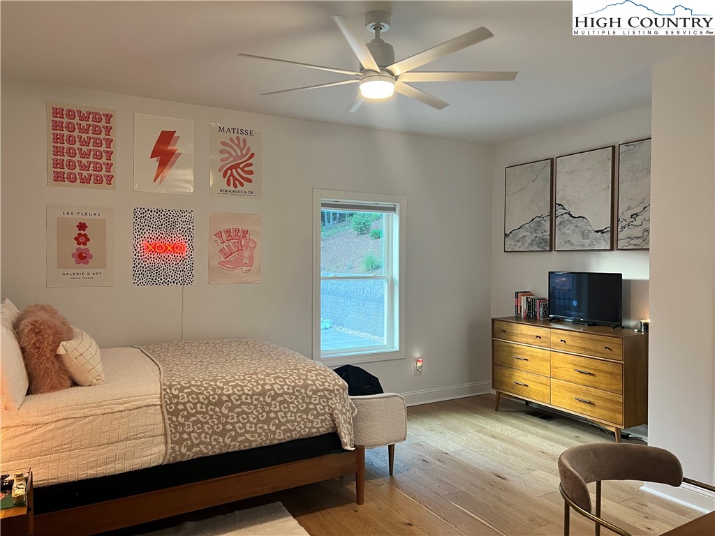 1701 Wildcat Road Deep Gap, NC 28618 - Photo 19 of 32 a bedroom with a bed and furniture