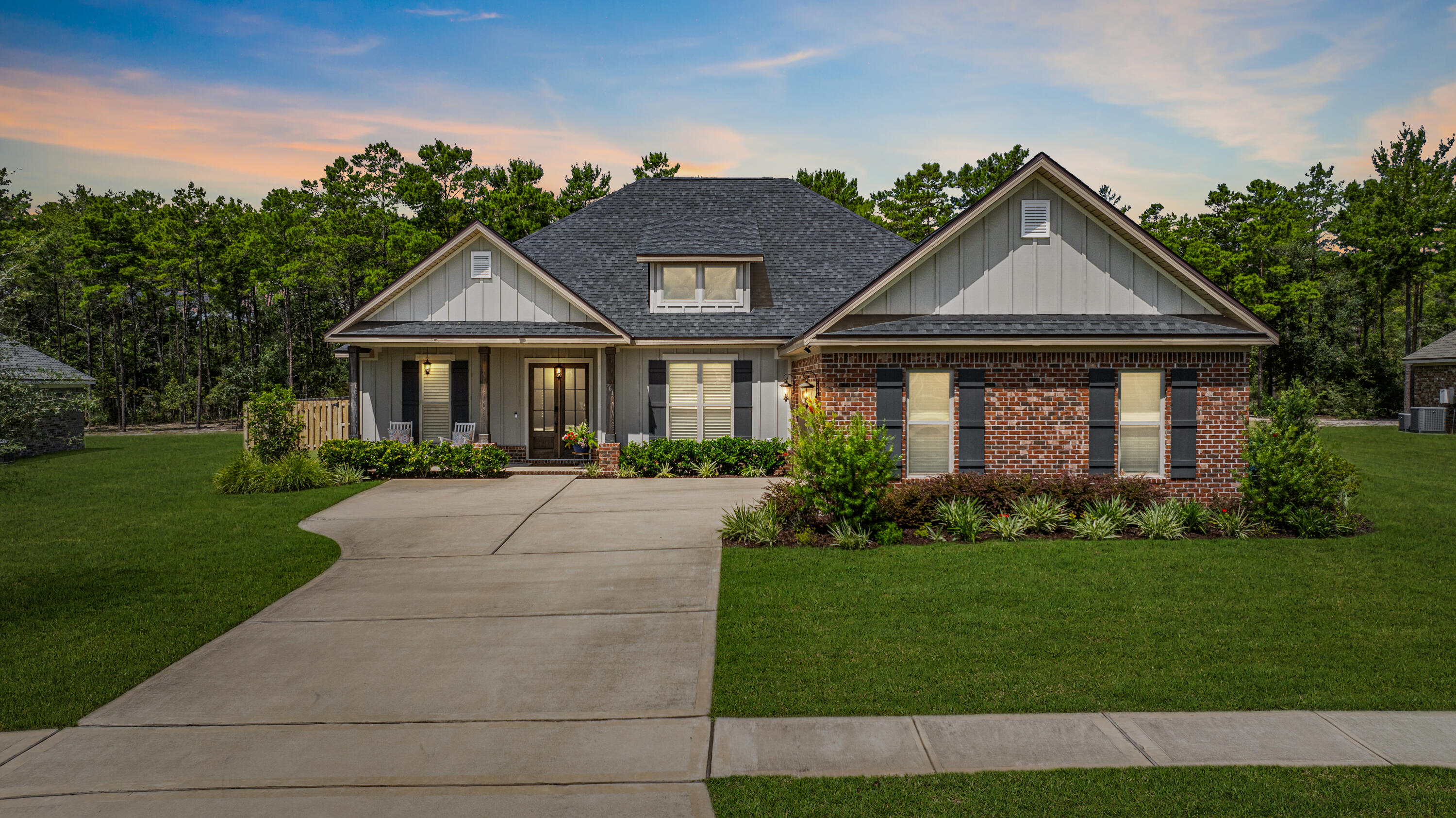301 Mill Pond Cove Freeport, FL 32439 - Photo 1 of 55 a front view of a house with a yard