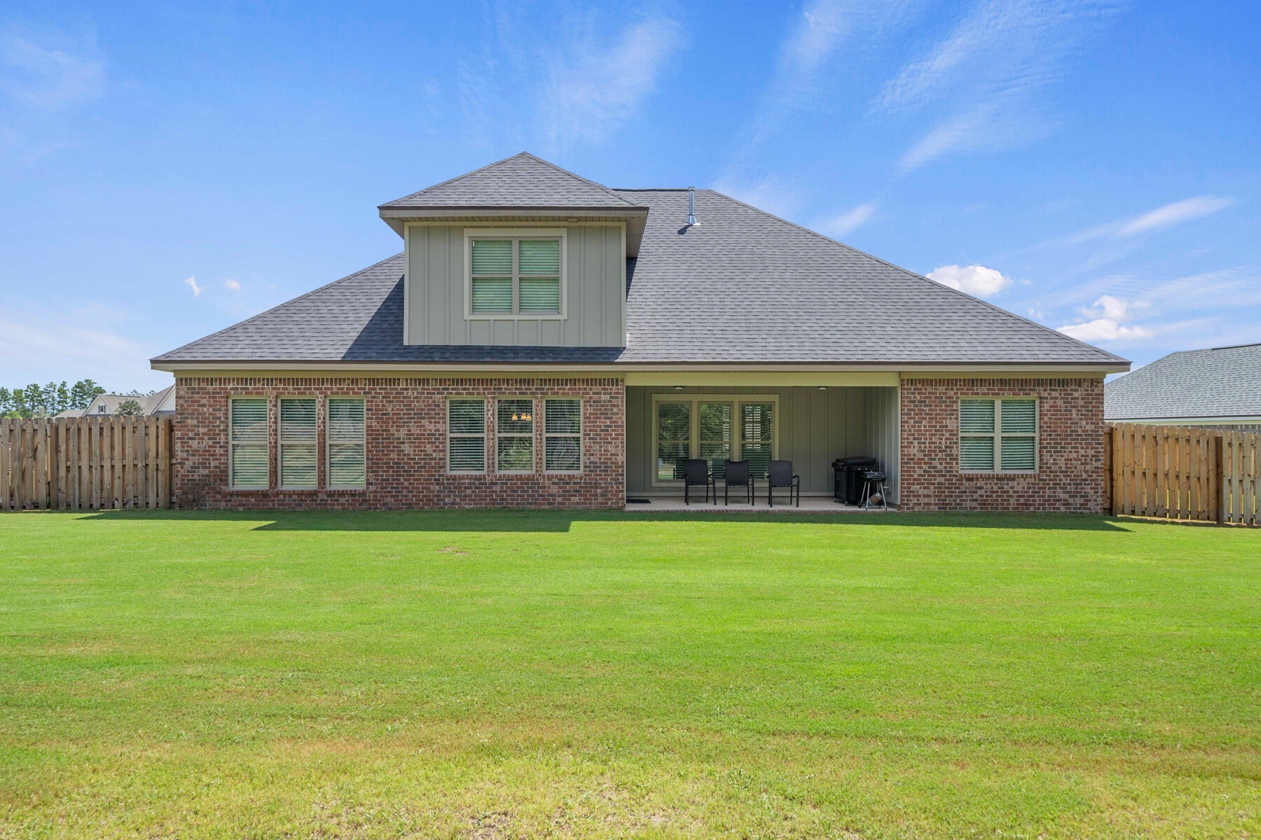 301 Mill Pond Cove Freeport, FL 32439 - Photo 11 of 55 a front view of a house with a yard