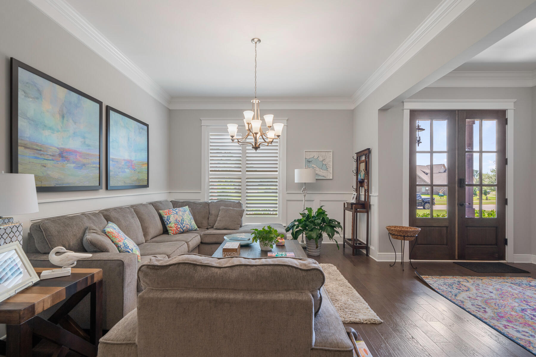 301 Mill Pond Cove Freeport, FL 32439 - Photo 19 of 55 a living room with furniture and a chandelier