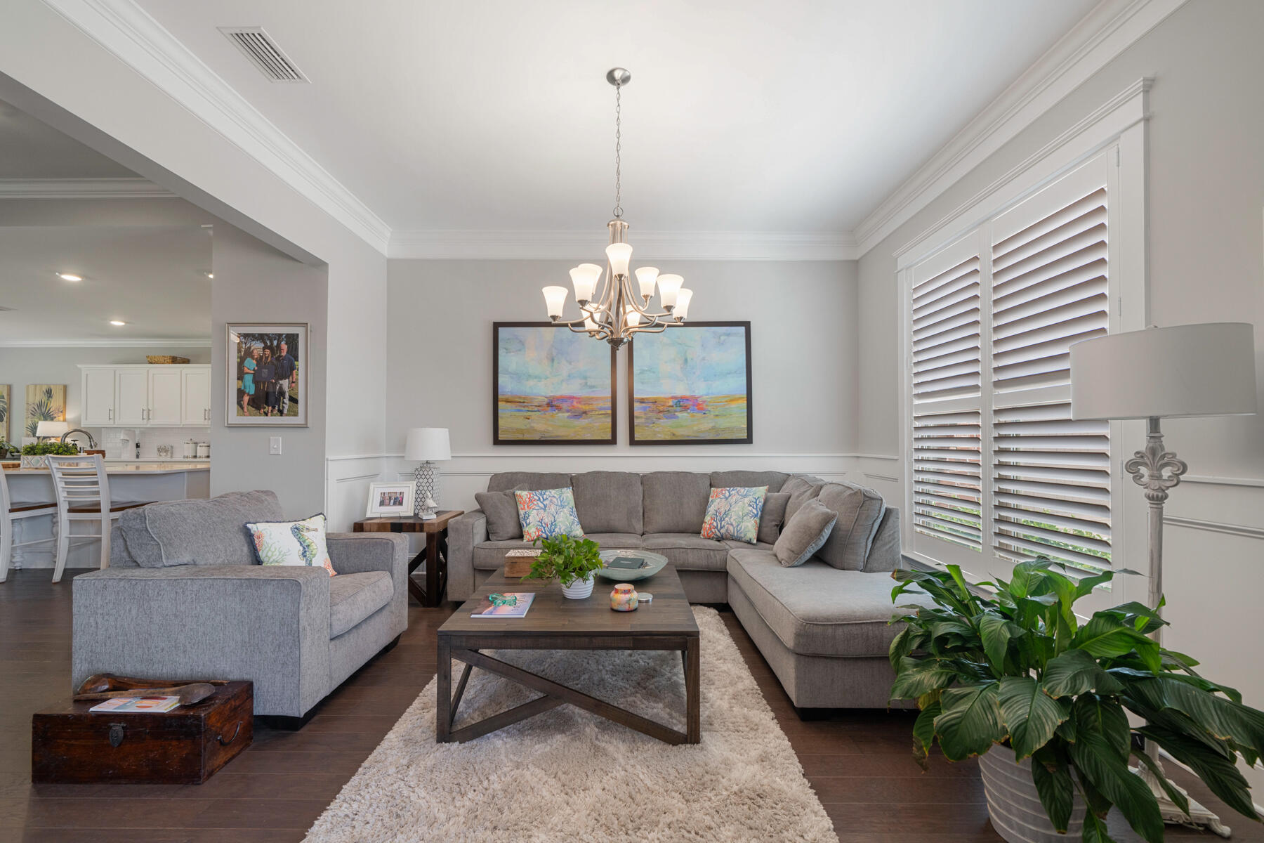 301 Mill Pond Cove Freeport, FL 32439 - Photo 20 of 55 a living room with furniture and a chandelier