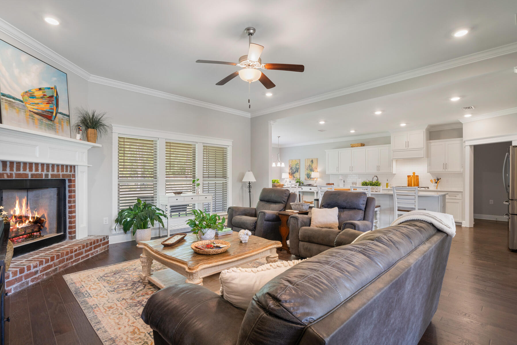 301 Mill Pond Cove Freeport, FL 32439 - Photo 21 of 55 a living room with furniture kitchen view and a fireplace
