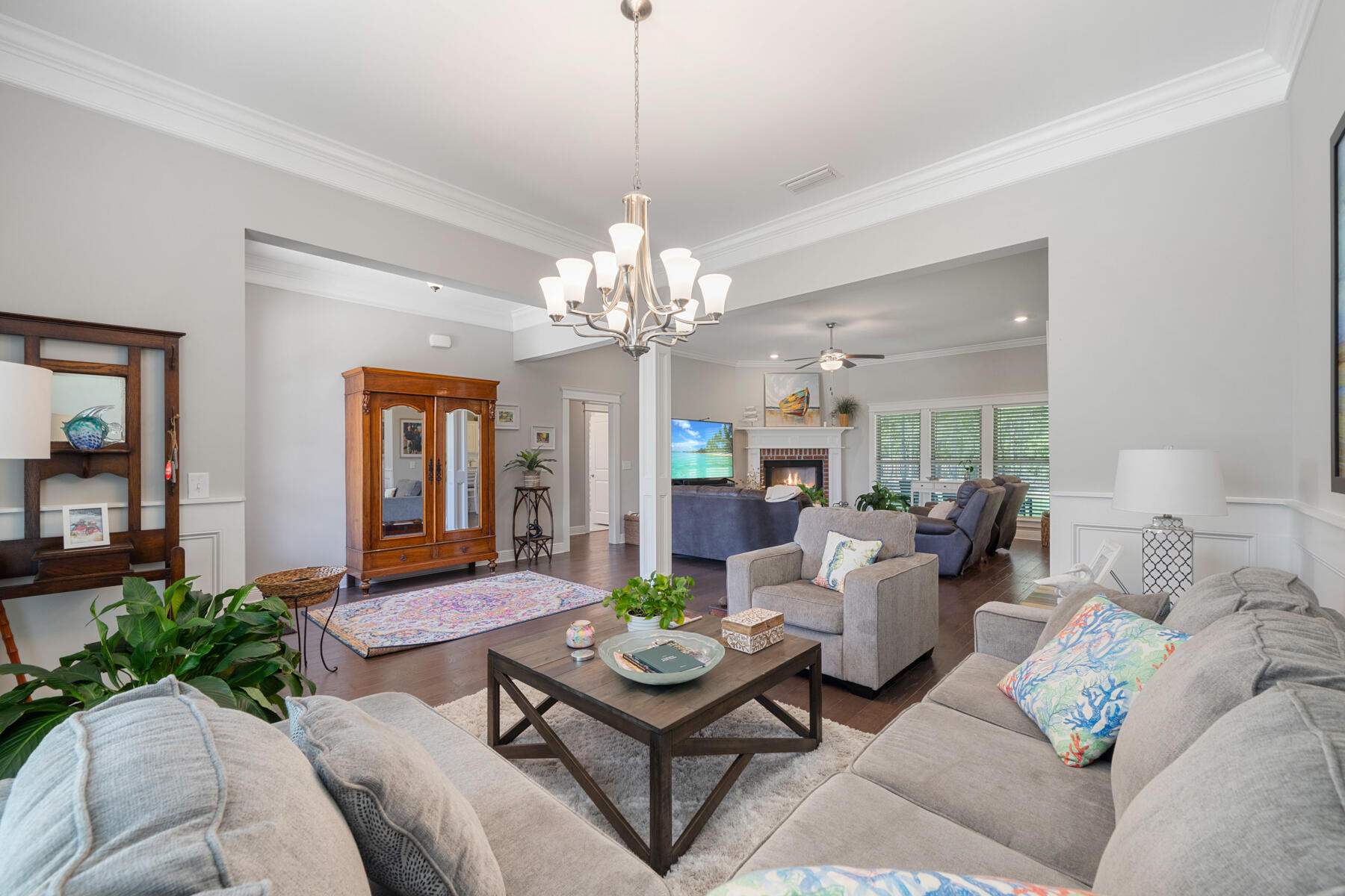 301 Mill Pond Cove Freeport, FL 32439 - Photo 22 of 55 a living room with furniture and a chandelier