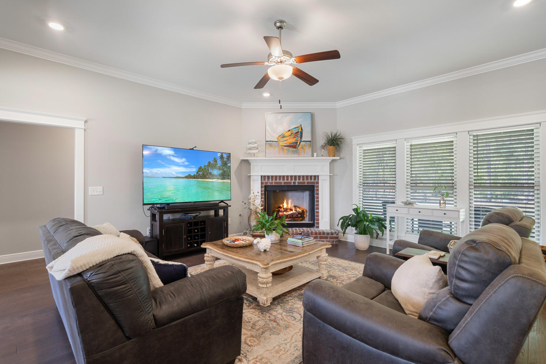 301 Mill Pond Cove Freeport, FL 32439 - Photo 23 of 55 a living room with furniture a fireplace and a flat screen tv