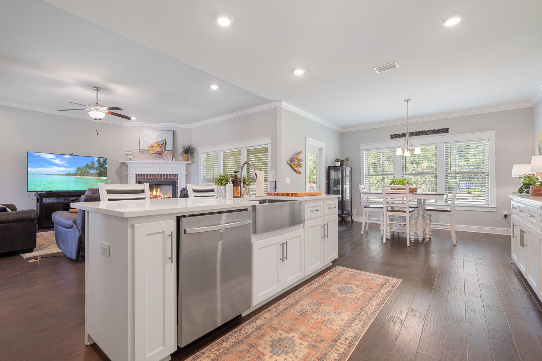 301 Mill Pond Cove Freeport, FL 32439 - Photo 24 of 55 a open kitchen with white cabinets and wooden floor