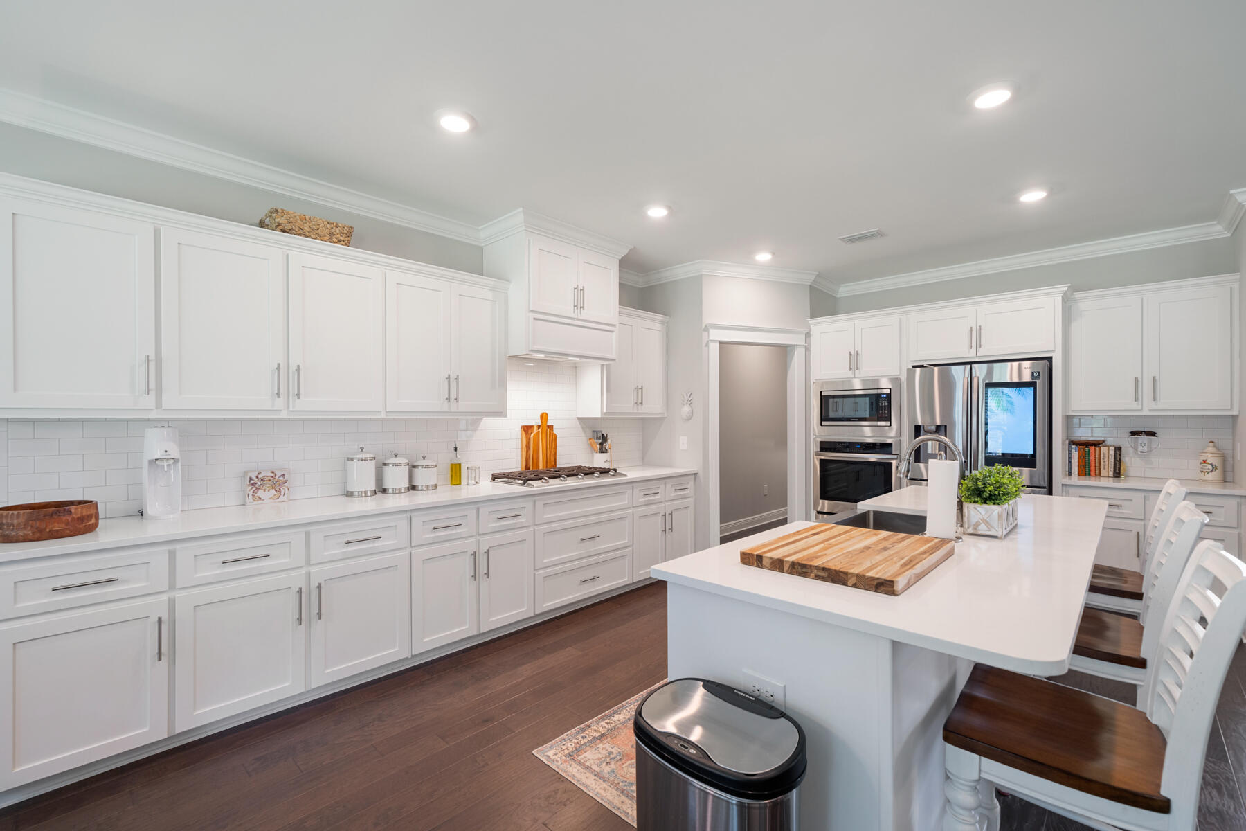 301 Mill Pond Cove Freeport, FL 32439 - Photo 25 of 55 a kitchen with white cabinets and stainless steel appliances