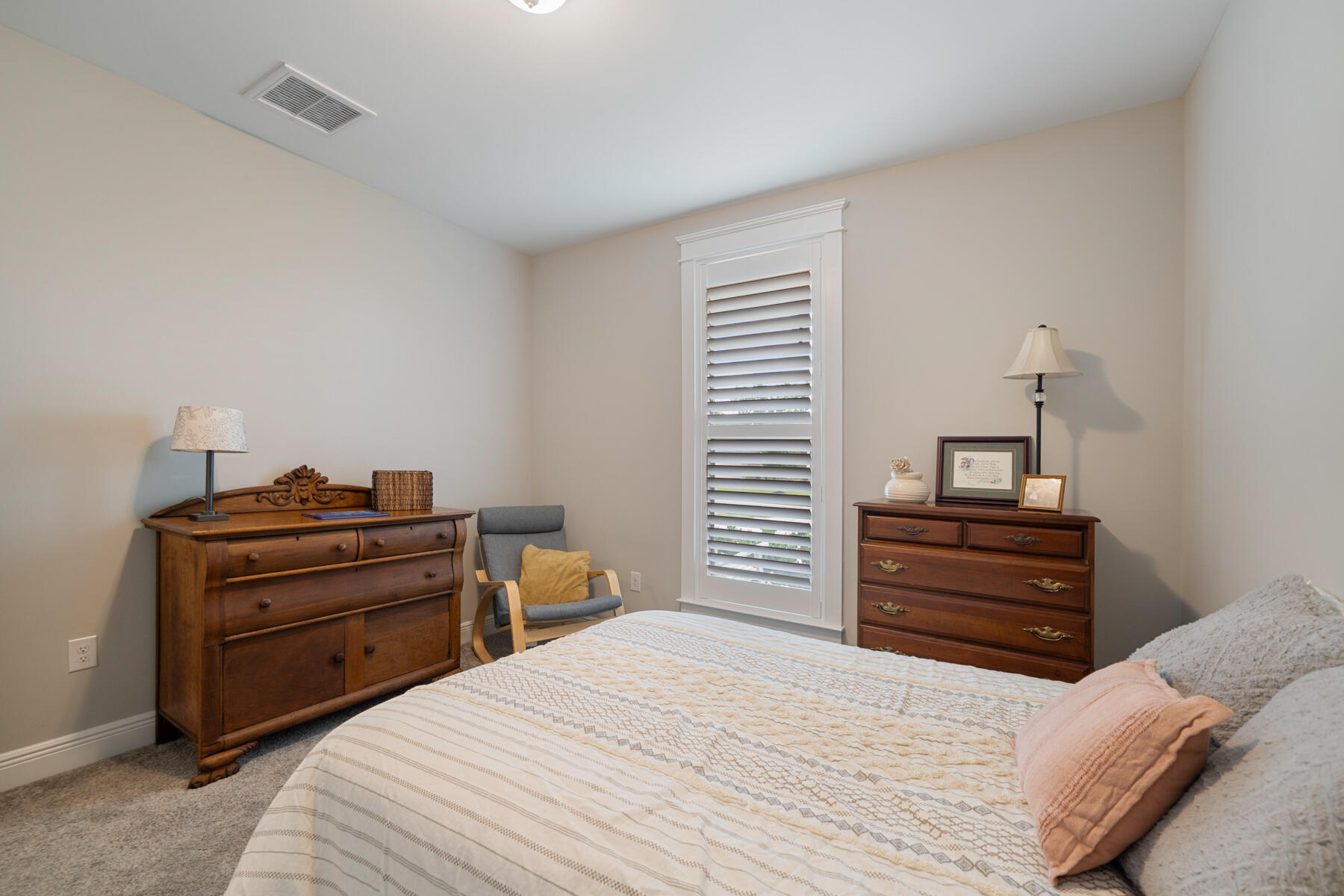 301 Mill Pond Cove Freeport, FL 32439 - Photo 29 of 55 a bedroom with a bed and a dresser