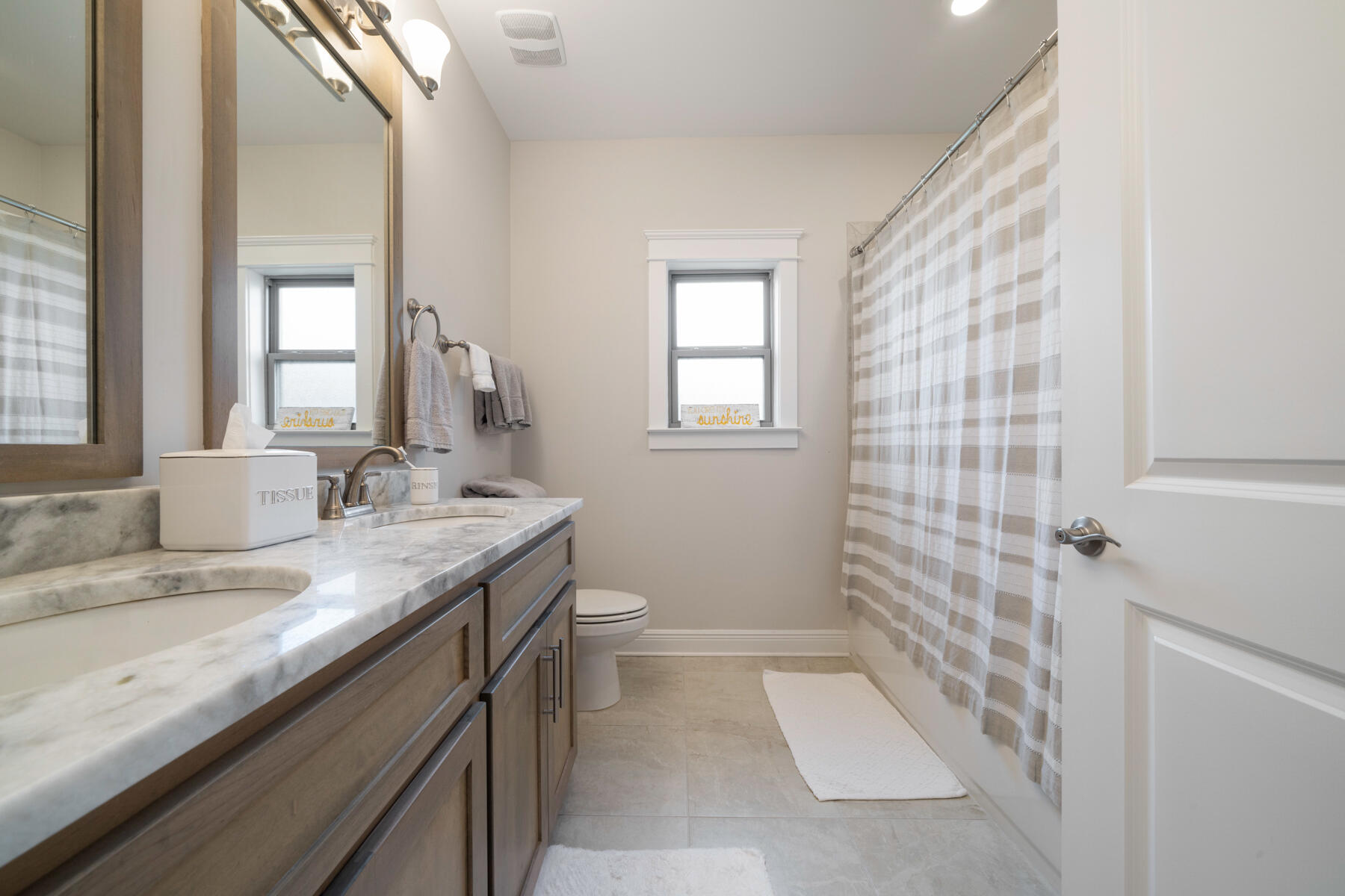 301 Mill Pond Cove Freeport, FL 32439 - Photo 30 of 55 a bathroom with a granite countertop sink a mirror and a shower