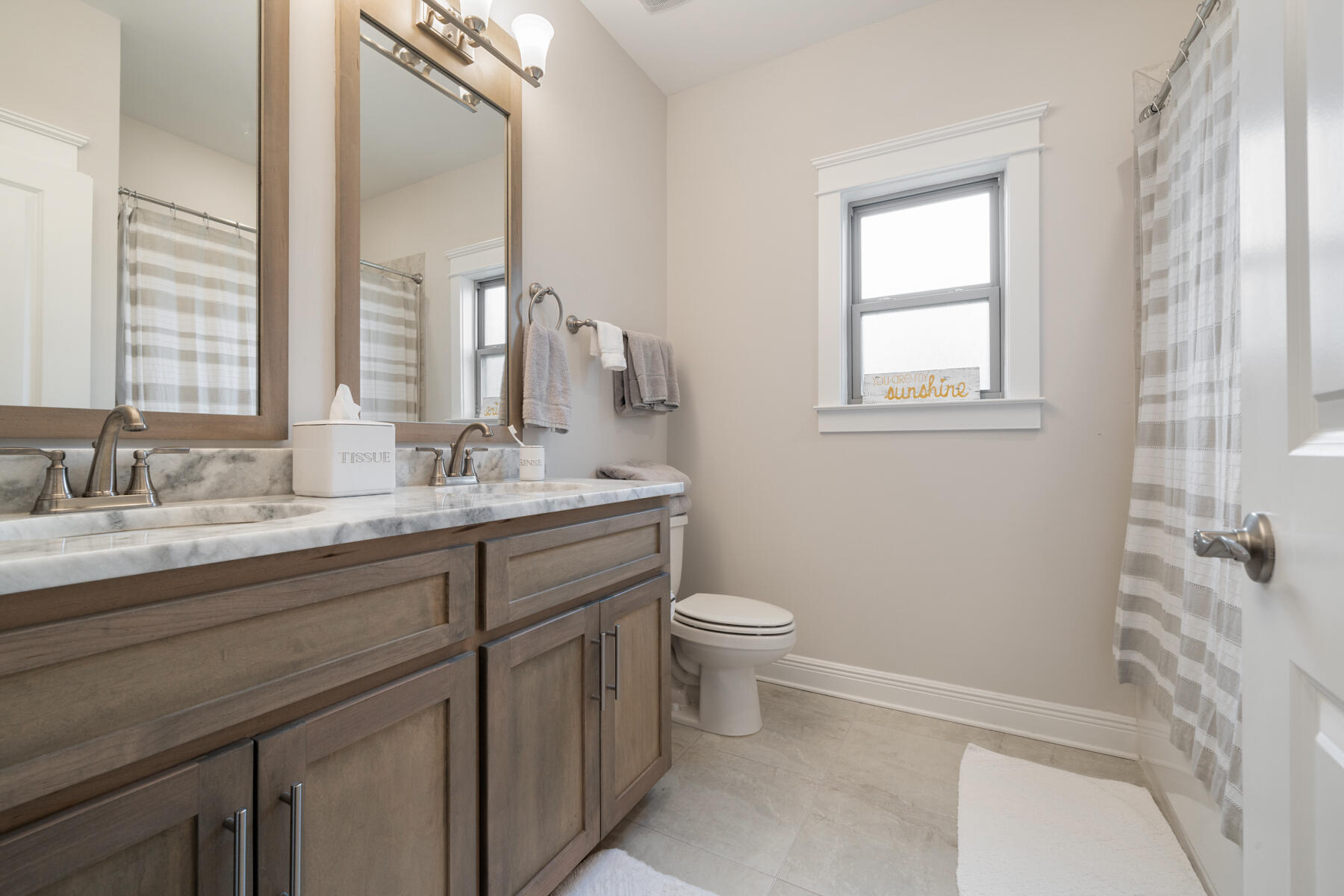 301 Mill Pond Cove Freeport, FL 32439 - Photo 31 of 55 a bathroom with a granite countertop sink toilet and shower