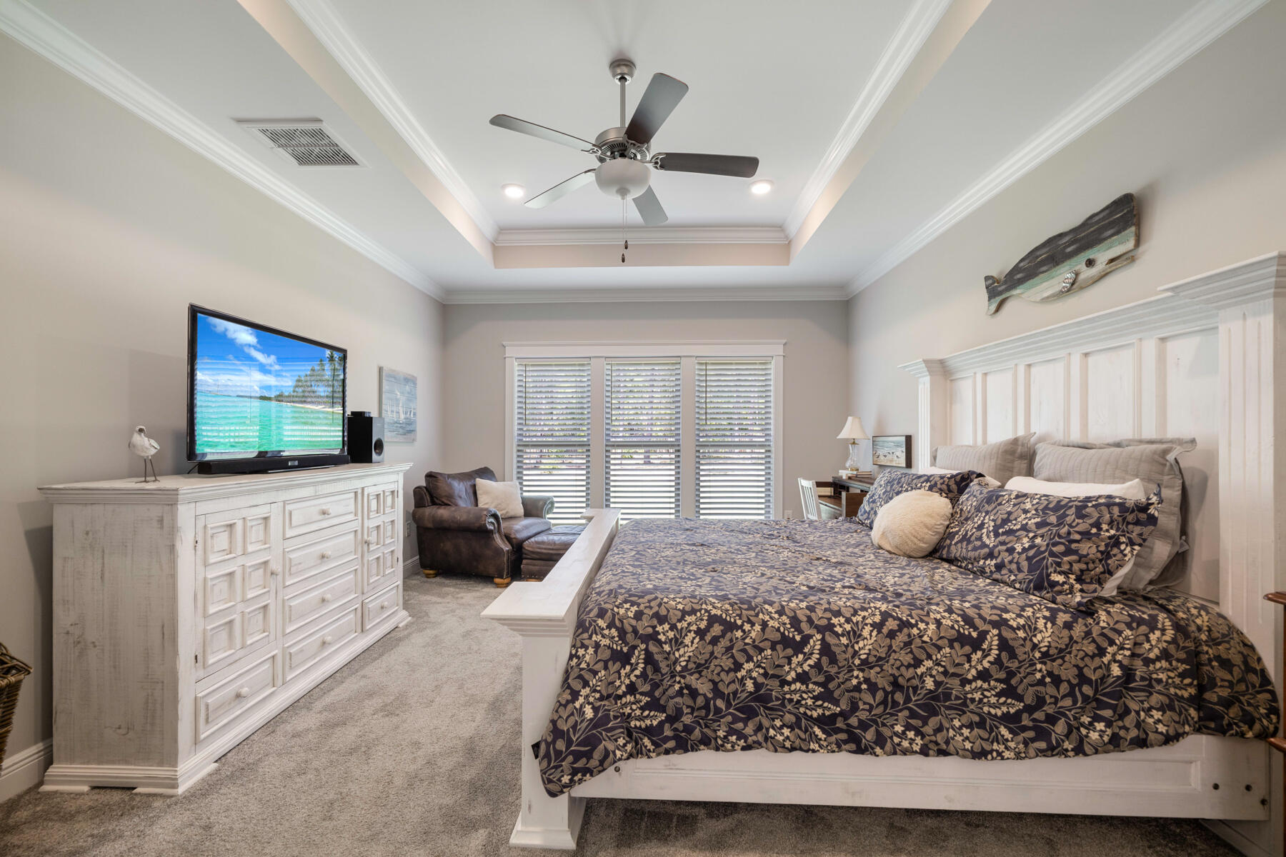 301 Mill Pond Cove Freeport, FL 32439 - Photo 35 of 55 a bedroom with a large bed and a flat screen tv