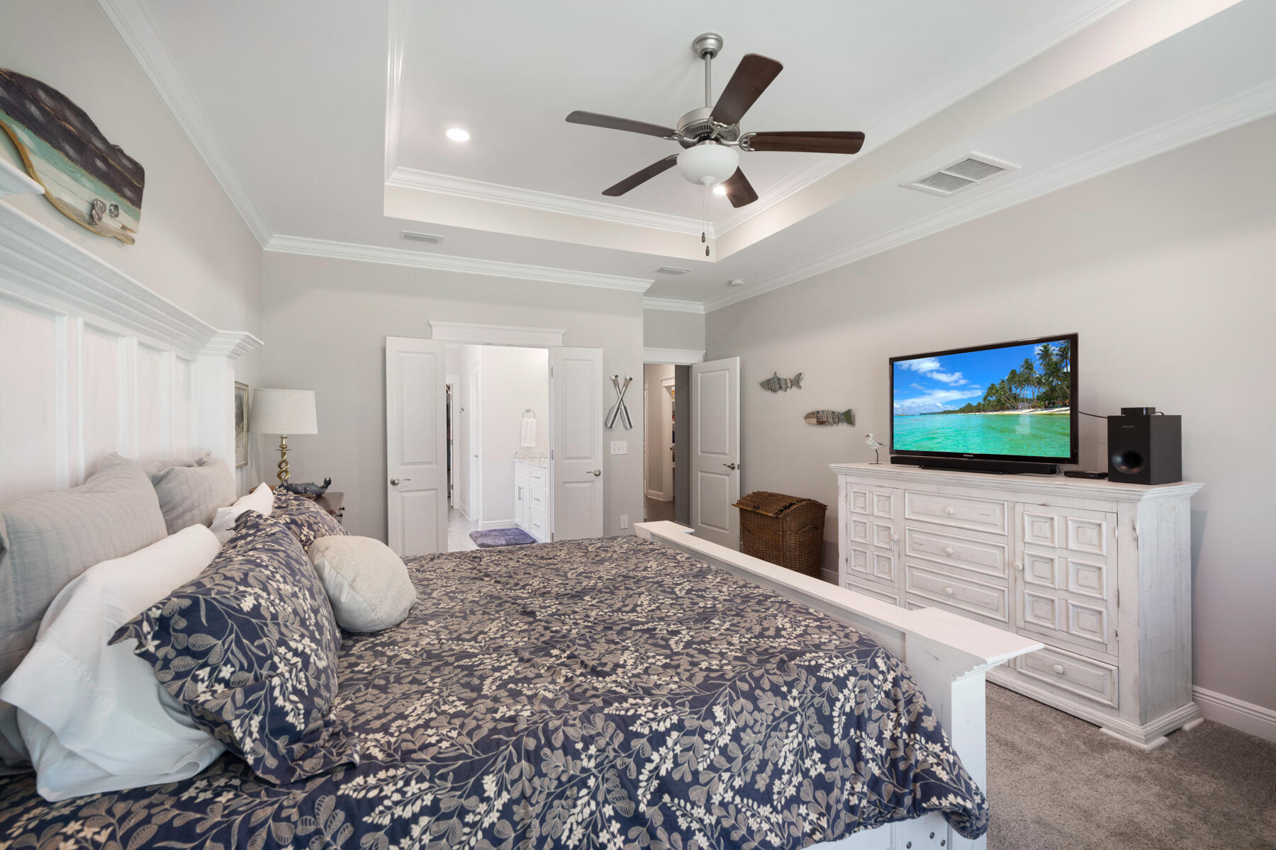 301 Mill Pond Cove Freeport, FL 32439 - Photo 36 of 55 a bedroom with a bed and a flat screen tv