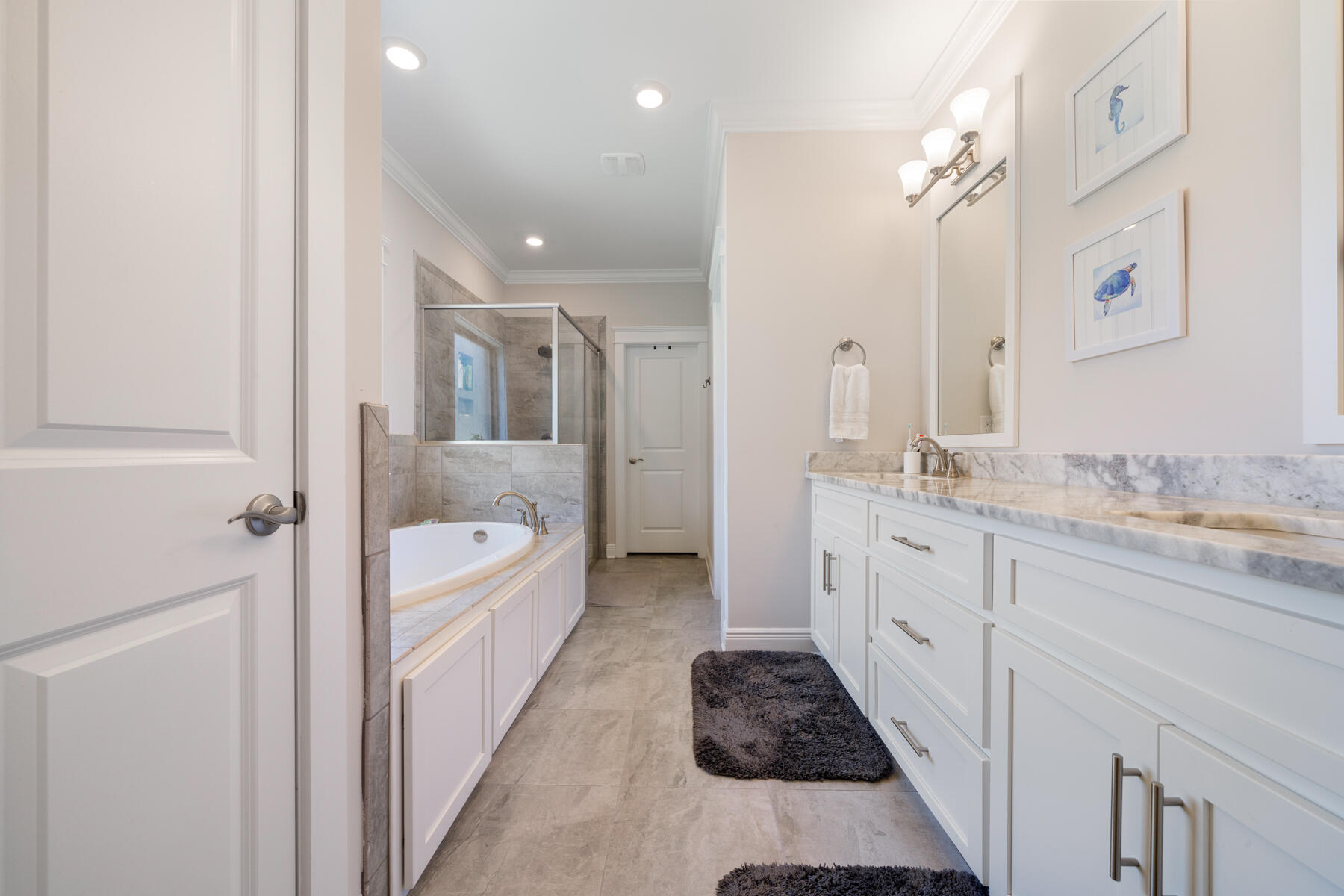 301 Mill Pond Cove Freeport, FL 32439 - Photo 37 of 55 a bathroom with a granite countertop sink a toilet a mirror and bathtub